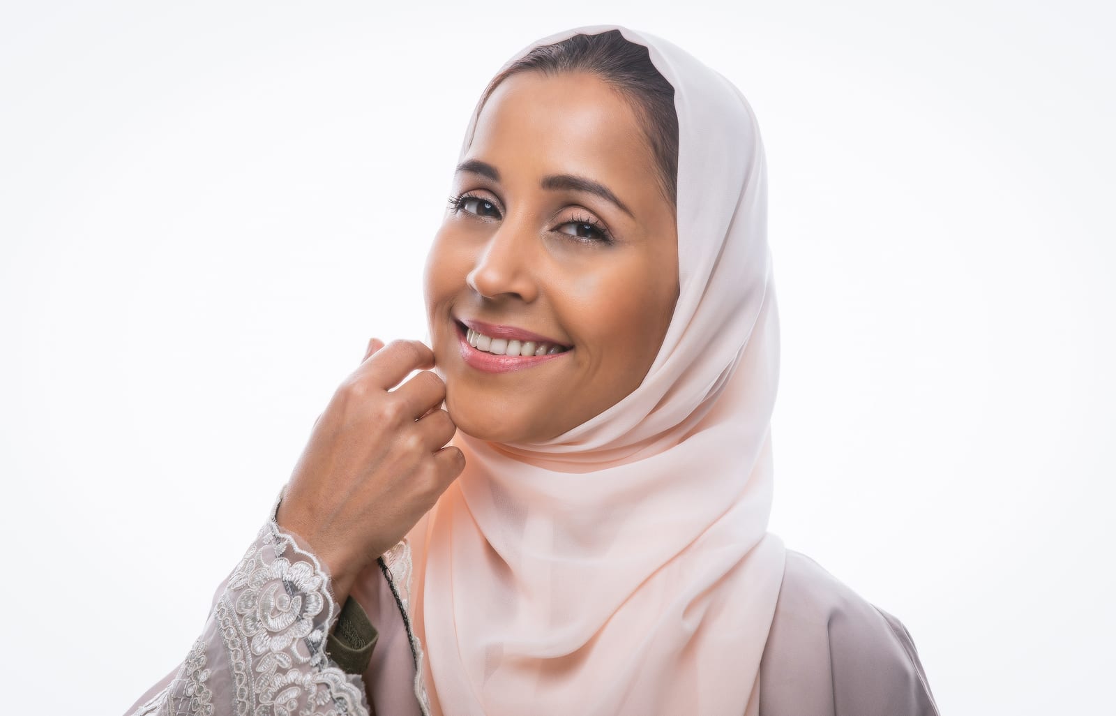 ClearLift | A portrait of a woman in a hijab smiling with bright and healthy skin