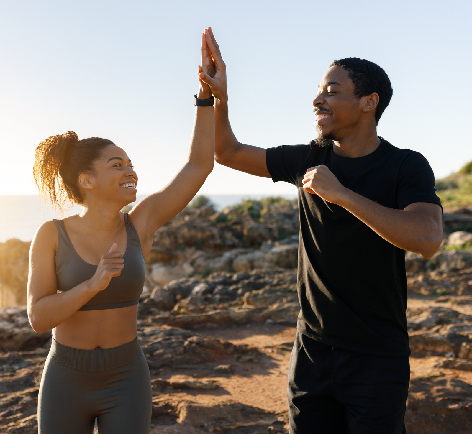 Exilis treatment | A couple giving each other a high-five.