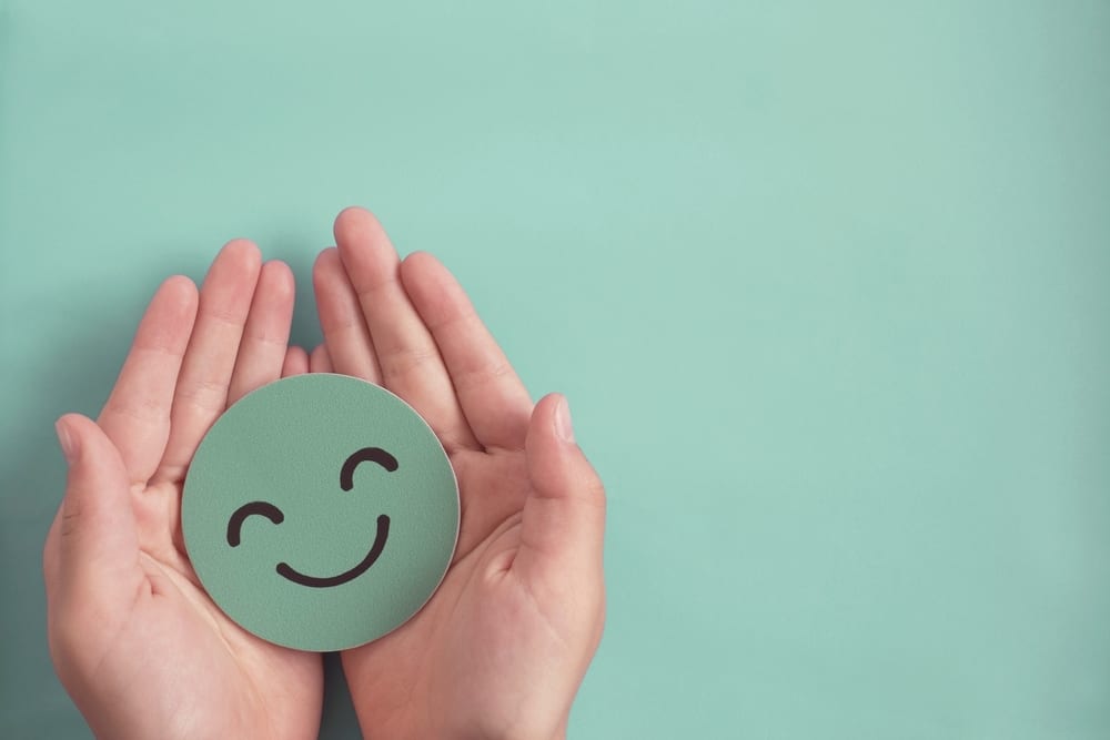Rosacea | A photo of someone holding a smiley face