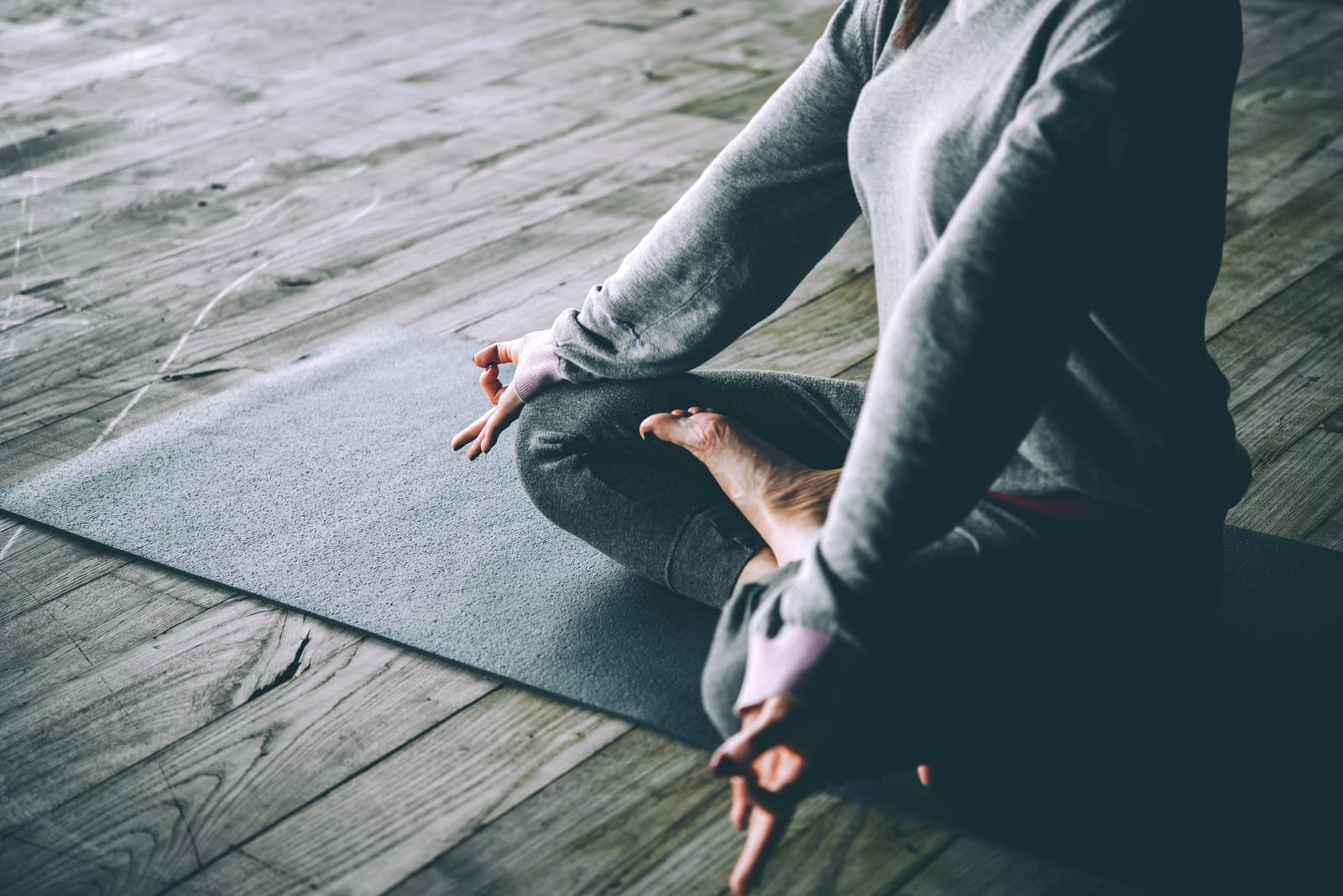 FemiLift | A person sitting in a meditation pose.