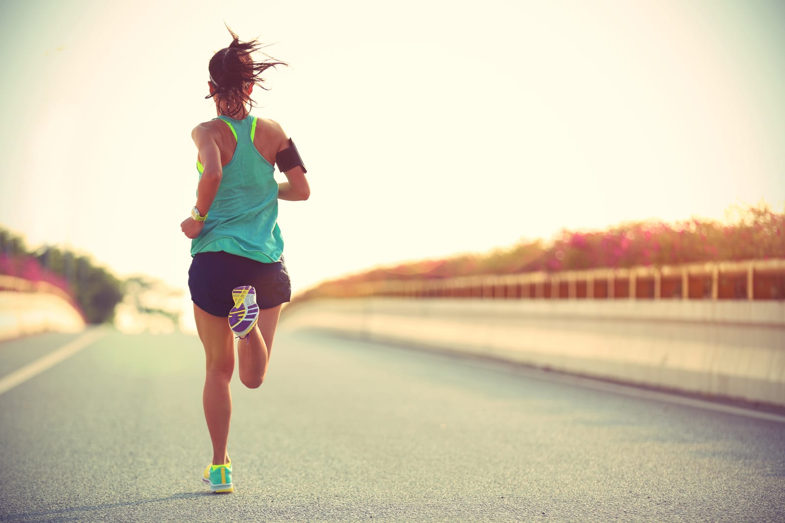 ClearLift | A woman running outdoors on the road